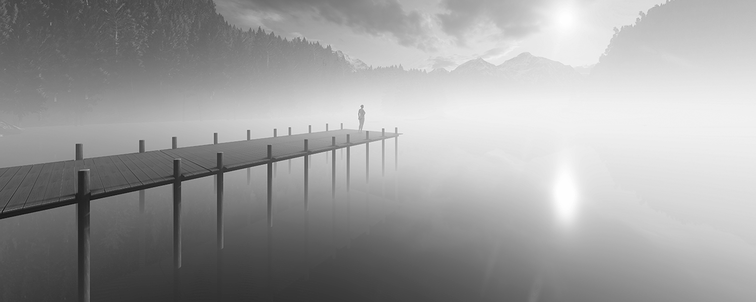 A woman stands alone enjoying the sun and fog.