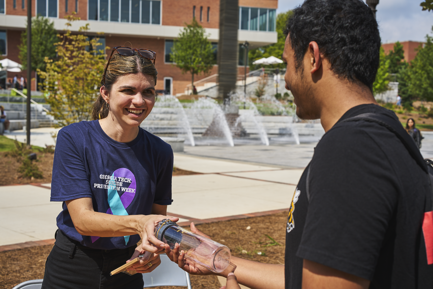 student talking to counselor at event